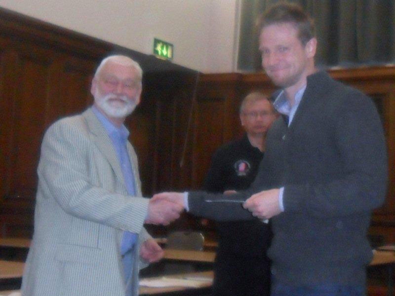 Bruce Holland presents GM Stephen Gordon with the runner-up prize