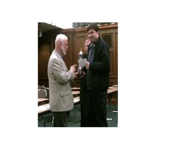 Bruce Holland presenting Jonathan Hawkins with the Open prize